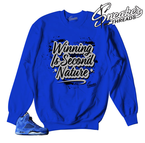 Number one sweaters match Jordan 5 blue suede sneakers